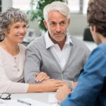 Senior couple meeting real estate agent. Senior couple meeting f